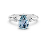 White gold Pear Cut Solitaire Diamond Engagement Ring with Twisted Pave Band and Four-Prong Setting