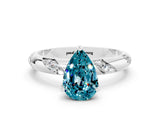 White gold Pear Cut Solitaire Diamond Engagement Ring with Twisted Pave Band and Four-Prong Setting