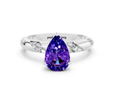 White gold Pear Cut Solitaire Diamond Engagement Ring with Twisted Pave Band and Four-Prong Setting