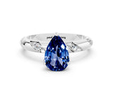 White gold Pear Cut Solitaire Diamond Engagement Ring with Twisted Pave Band and Four-Prong Setting