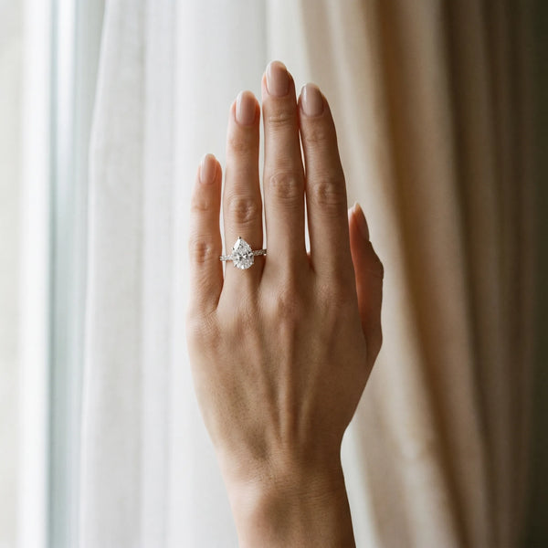 White gold Pear Cut Solitaire Diamond Ring with Pave Band and Four-Prong Setting
