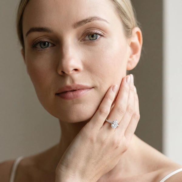 White gold Pear Cut Solitaire Diamond Ring with Pave Band and Four-Prong Setting