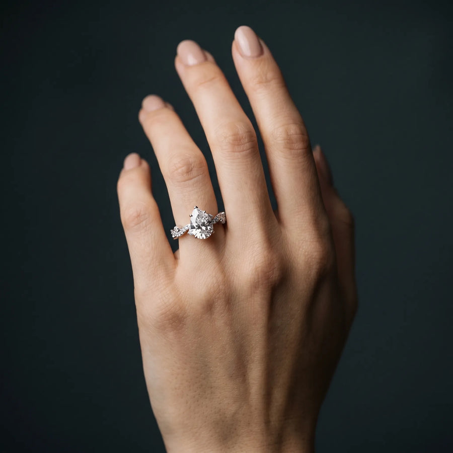 White gold Pear Cut Solitaire Diamond Twisted Band with Pave Setting