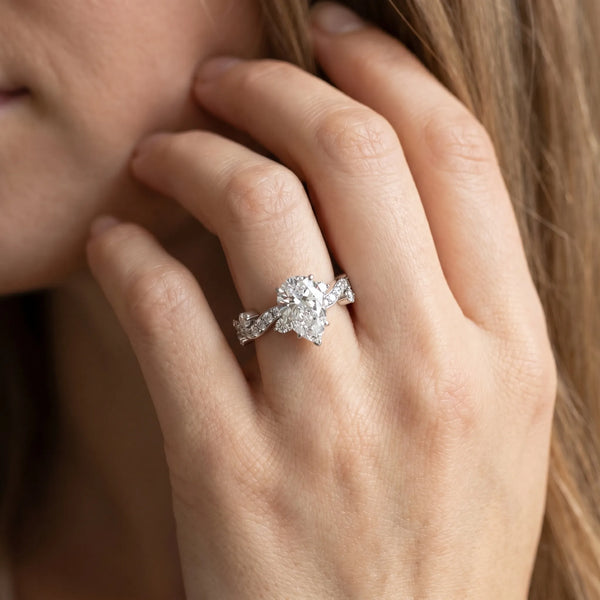 White gold Pear Cut Solitaire Diamond Twisted Band with Pave Setting