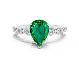 White gold Pear Cut Solitaire Emerald Ring with Pave Band and Four-Prong Setting