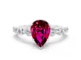 White gold Pear Cut Solitaire Garnet Ring with Pave Band and Four-Prong Setting