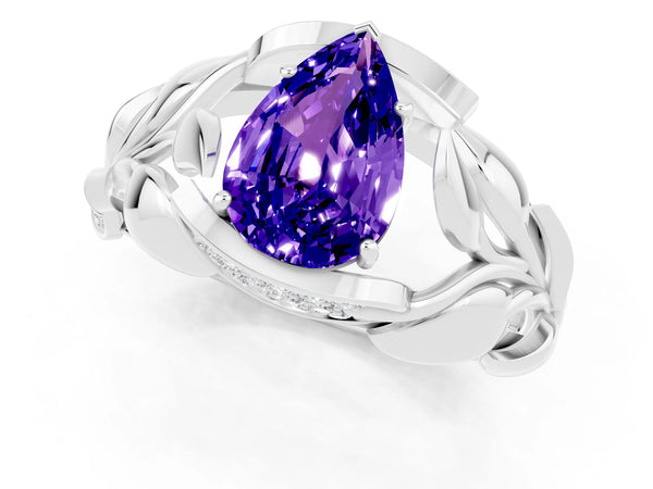 Platinum Pear Cut Tanzanite Leaf-Inspired Engagement Ring with Round Accents and Prong Setting