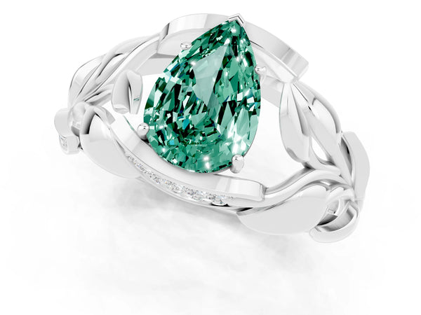 Platinum Pear Cut Green Sapphire Leaf-Inspired Engagement Ring with Round Accents and Prong Setting