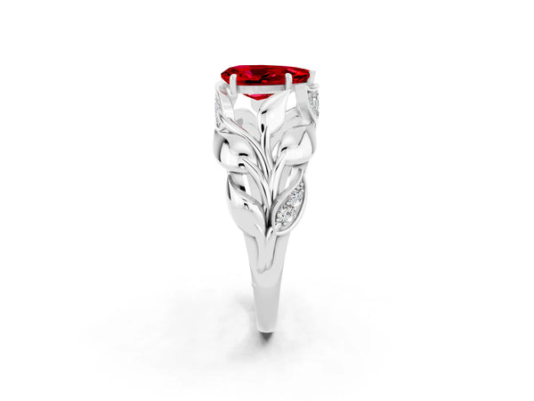 Silver Pear Cut Ruby Leaf-Inspired Engagement Ring with Round Accents and Prong Setting
