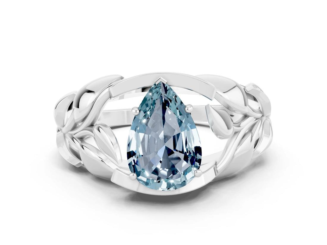 White gold Pear Cut Solitaire Leaf-Inspired Engagement Ring with Prong Setting
