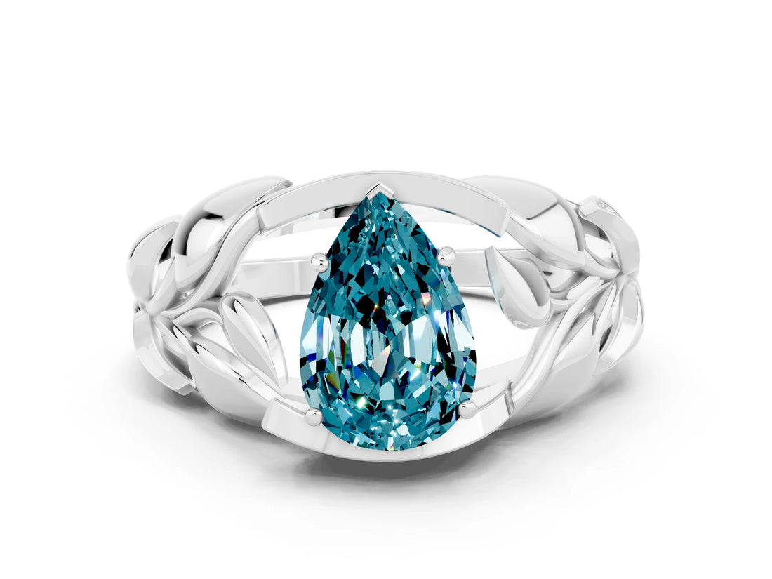 White gold Pear Cut Solitaire Leaf-Inspired Engagement Ring with Prong Setting