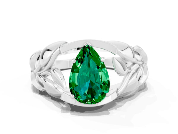 White gold Pear Cut Emerald Leaf-Inspired Engagement Ring with Round Accents and Prong Setting
