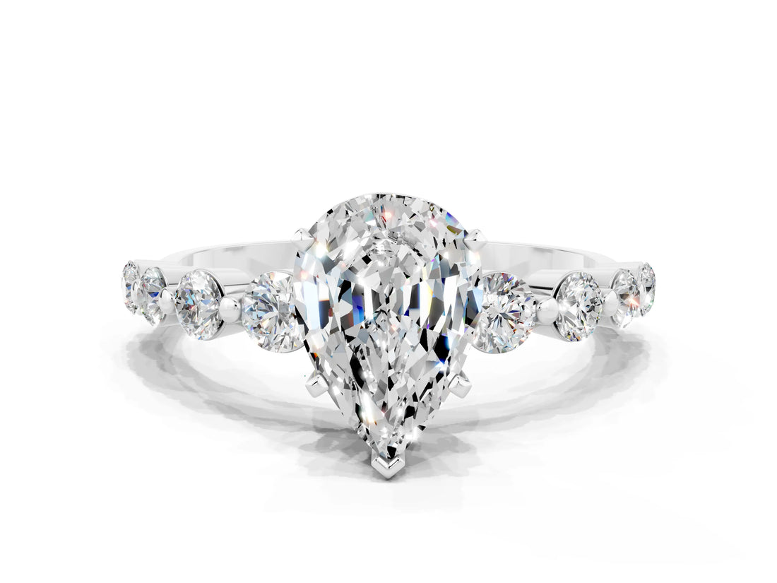 White gold Pear Cut Solitaire Moissanite Ring with Pave Band and Four-Prong Setting