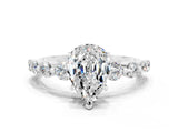 White gold Pear Cut Solitaire Moissanite Ring with Pave Band and Four-Prong Setting