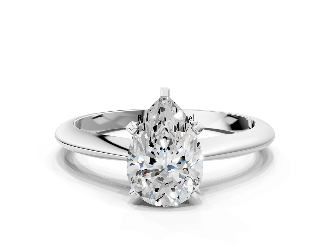 White gold Pear Cut Solitaire Ring with Four-Prong Setting on a Classic Band_105