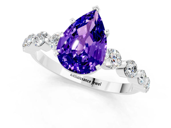 White gold Pear Cut Solitaire Tanzanite Ring with Pave Band and Four-Prong Setting