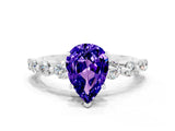 White gold Pear Cut Solitaire Tanzanite Ring with Pave Band and Four-Prong Setting