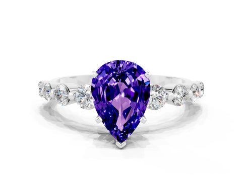 White gold Pear Cut Solitaire Tanzanite Ring with Pave Band and Four-Prong Setting