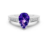 White gold Pear Cut Tanzanite Engagement Ring with Milgrain Channel Set Band and Prong Setting