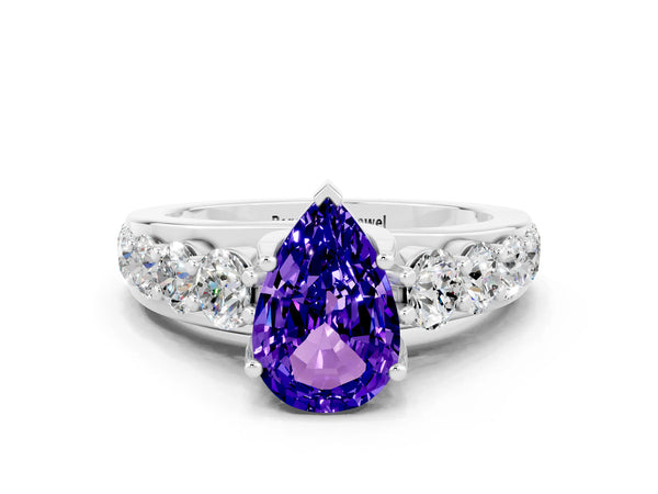 Platinum Pear Cut Tanzanite Engagement Ring with Pavé Band and Four-Prong Setting