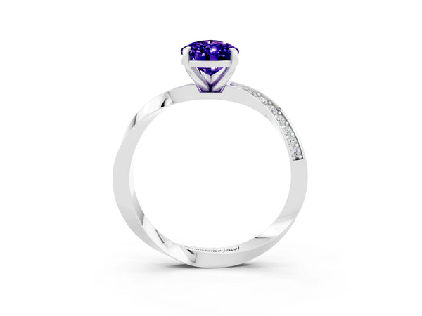 White gold Pear Cut Tanzanite Engagement Ring with Side Stone Accents and Four-Prong Setting