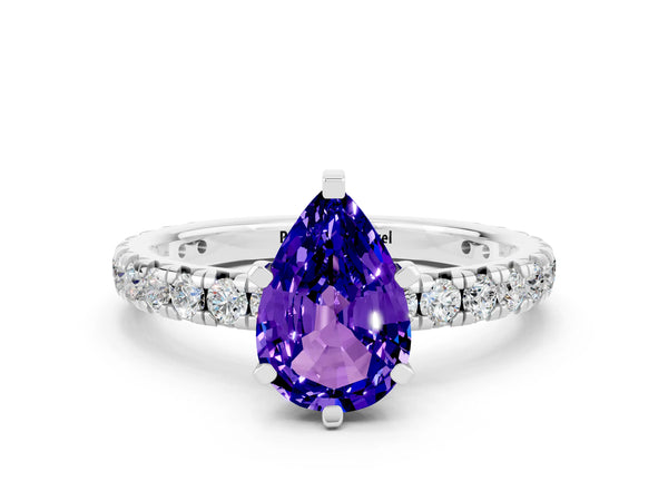 Platinum Pear Cut Tanzanite Pavé Solitaire Ring with Round Band and Prong Setting