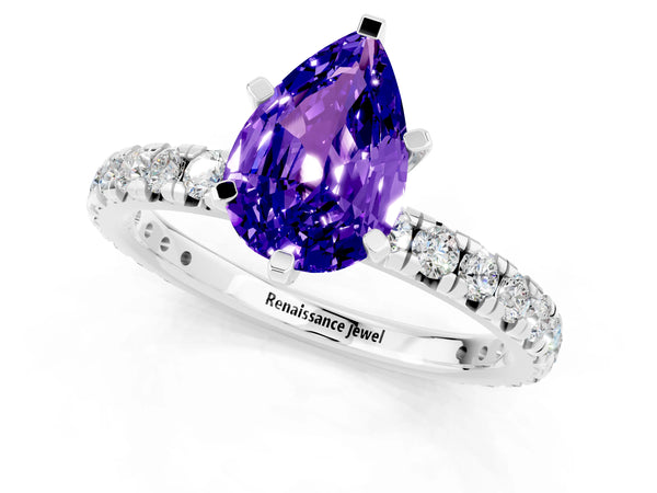 Platinum Pear Cut Tanzanite Pavé Solitaire Ring with Round Band and Prong Setting