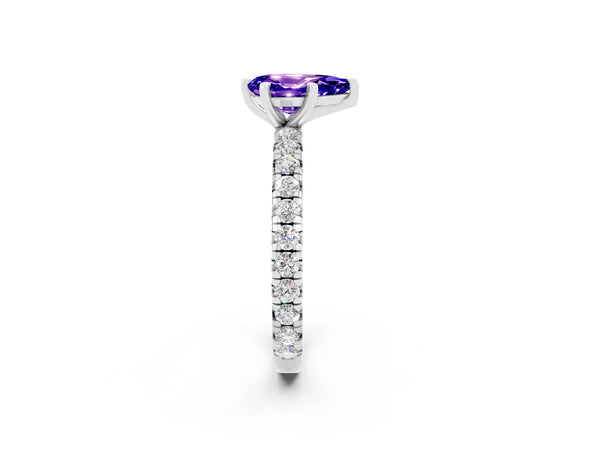 Platinum Pear Cut Tanzanite Pavé Solitaire Ring with Round Band and Prong Setting