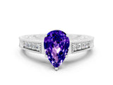 White gold Pear Cut Tanzanite Ring with Milgrain Pavé Band and Four-Prong Setting_30