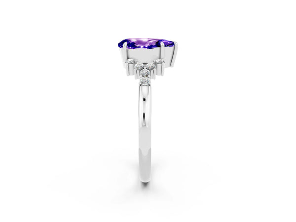 Platinum Pear Cut Tanzanite Ring with Side Stones and Four-Prong Setting