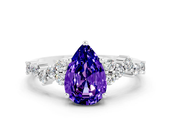 Platinum Pear Cut Tanzanite Scattered Round Accent Ring with Prong Setting