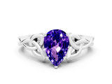 White gold Pear Cut Tanzanite Solitaire Engagement Ring with Celtic Knot Band and Four-Prong Setting