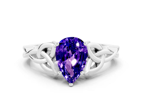 White gold Pear Cut Tanzanite Solitaire Engagement Ring with Celtic Knot Band and Four-Prong Setting