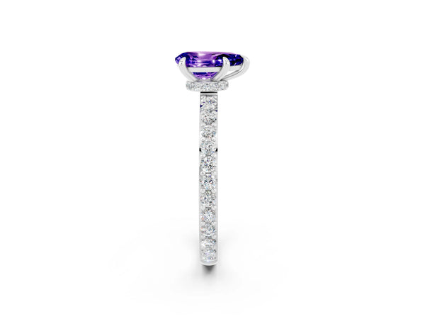 Platinum Pear Cut Tanzanite Solitaire Engagement Ring with Pavé Band and Four-Prong Setting