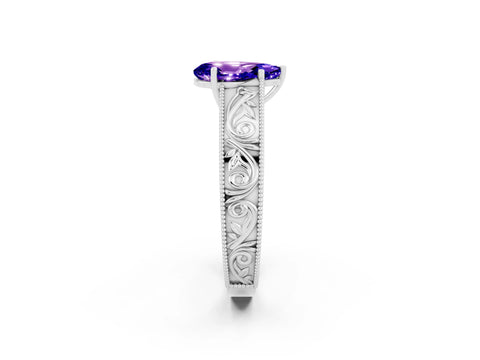 White gold Pear Cut Tanzanite Solitaire Ring with Engraved Band and Four-Prong Setting_2