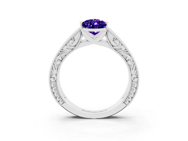 White gold Pear Cut Tanzanite Solitaire Ring with Engraved Band and Four-Prong Setting