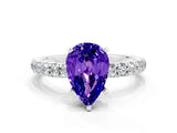 White gold Pear Cut Tanzanite Solitaire Ring with Pavé Accents and Four-Prong Setting
