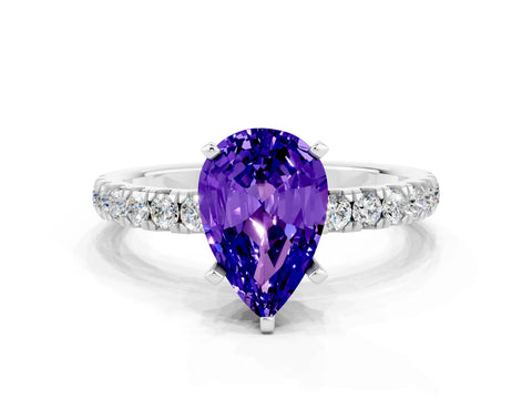White gold Pear Cut Tanzanite Solitaire Ring with Pavé Accents and Four-Prong Setting