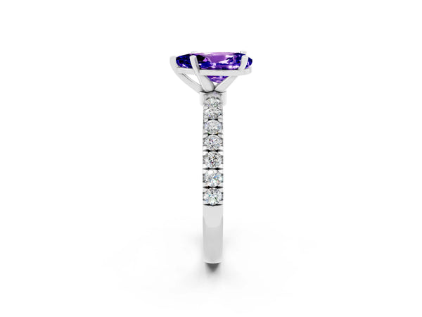 Platinum Pear Cut Tanzanite Solitaire Ring with Pavé Accents and Four-Prong Setting