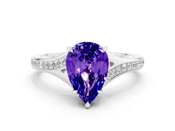 White gold Pear Cut Tanzanite Solitaire Ring with Pavé Band and Prong Setting