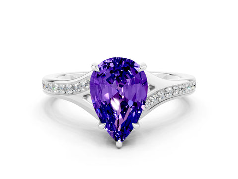 White gold Pear Cut Tanzanite Solitaire Ring with Pavé Band and Prong Setting