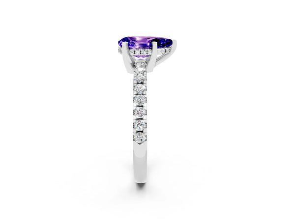 White gold Pear Cut Tanzanite Solitaire Ring with Round  Pavé Band and Four-Prong Setting