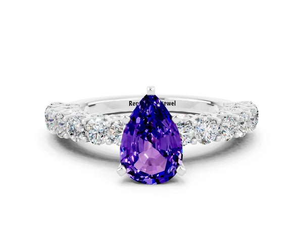 Platinum Pear Cut Tanzanite Solitaire Ring with Shared Prong Pavé Band and Four-Prong Setting