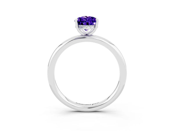 Platinum Pear Cut Tanzanite Solitaire Ring with Thin Band and Four-Prong Setting