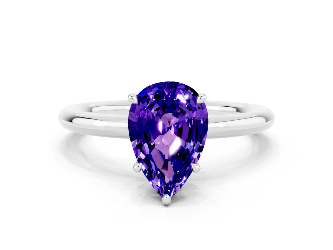 White gold Pear Cut Tanzanite Solitaire Ring with Thin Band and Four-Prong Setting