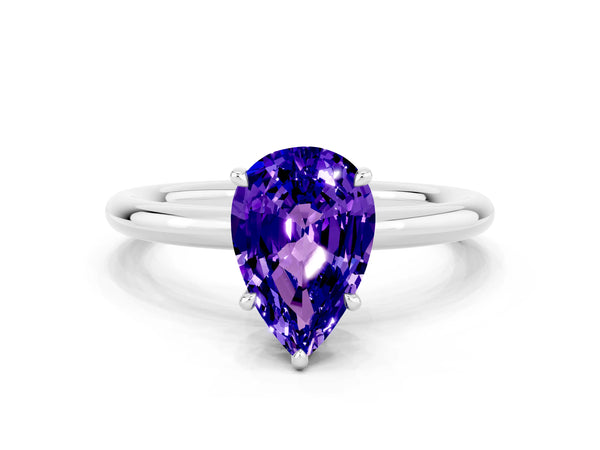 Silver Pear Cut Tanzanite Solitaire Ring with Thin Band and Four-Prong Setting