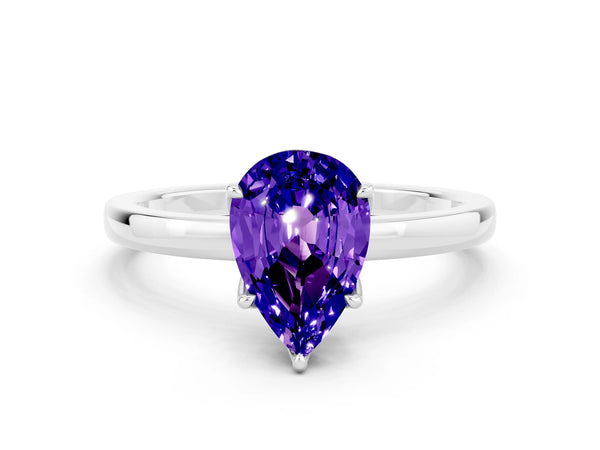 Platinum Pear Cut Tanzanite Solitaire Ring with Thin Band and Prong Setting