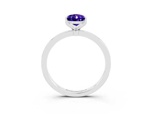 Platinum Pear Cut Tanzanite Solitaire Ring with Thin Band and Prong Setting