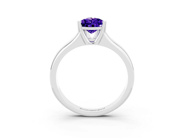 Platinum Pear Cut Tanzanite Solitaire Ring with Wide Band and Prong Setting