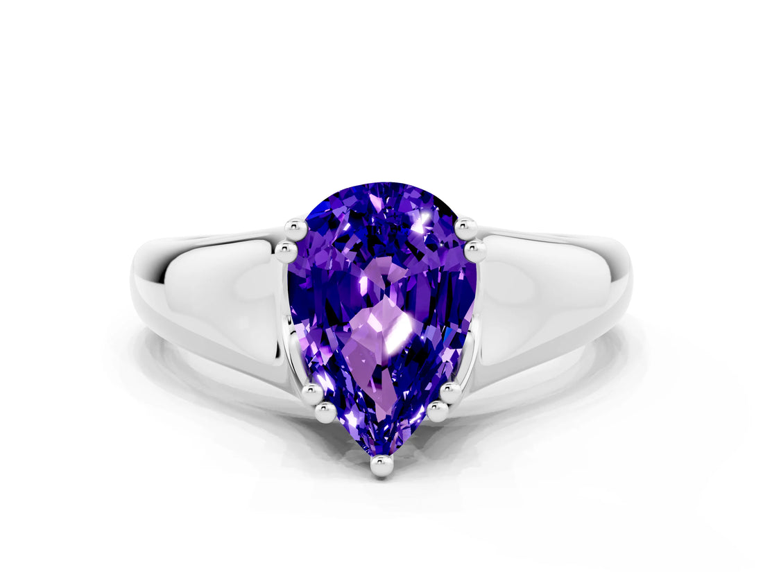 White gold Pear Cut Tanzanite Solitaire Ring with Wide Band and Prong Setting